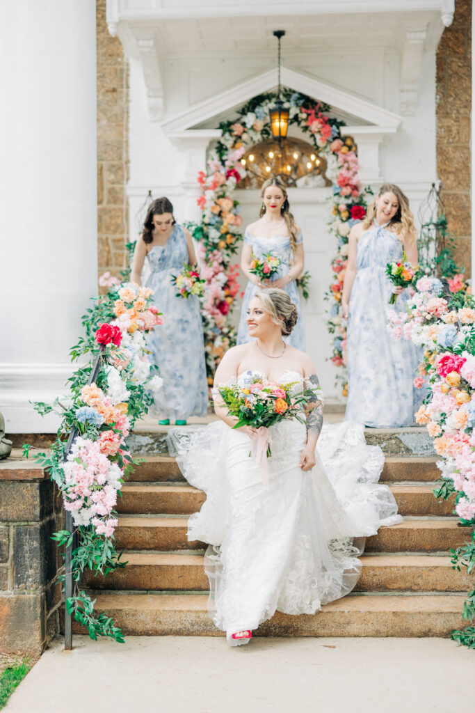 bridal party image with florals with a bridesmaid. image shows the importance of investing in luxury wedding photography