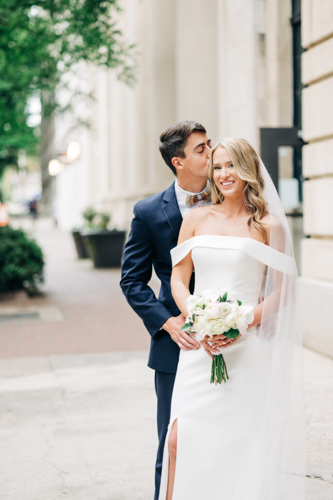 Bride and Groom portrait showing emotion and joy displaying the importance of investing in luxury wedding photos