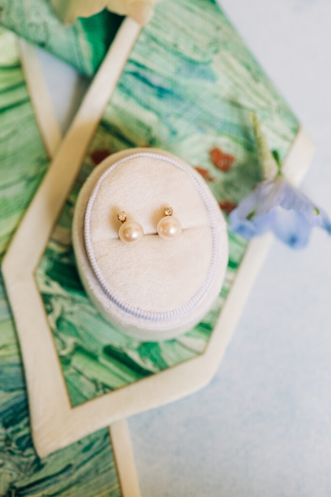 Close up of wedding earrings styled by South Carolina wedding photographers.