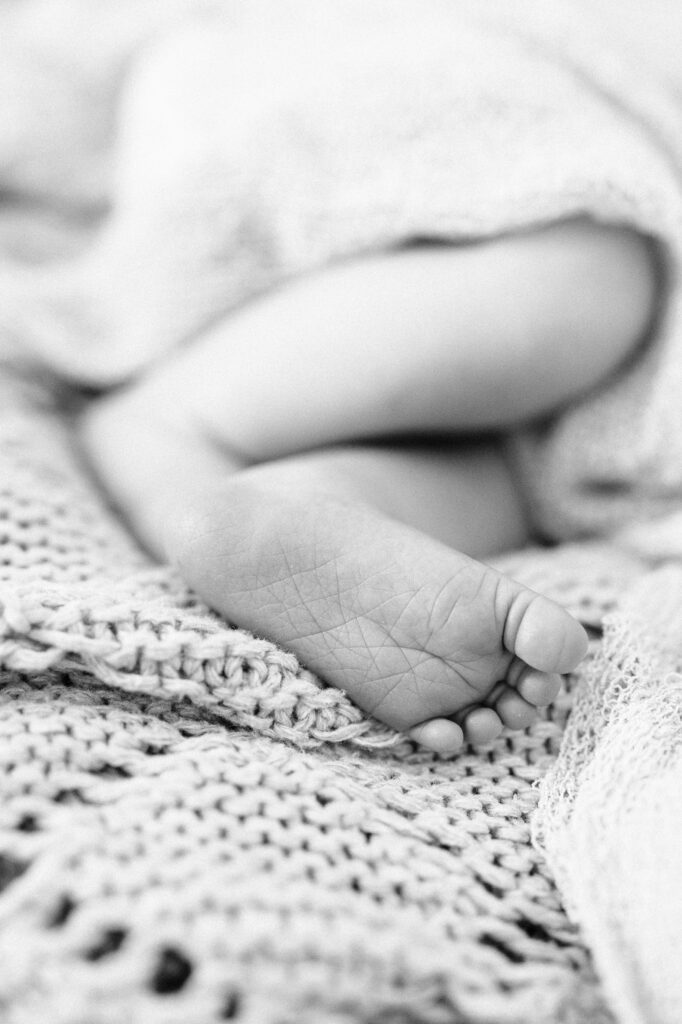 Close-up of newborn baby feet during lifestyle newborn photography