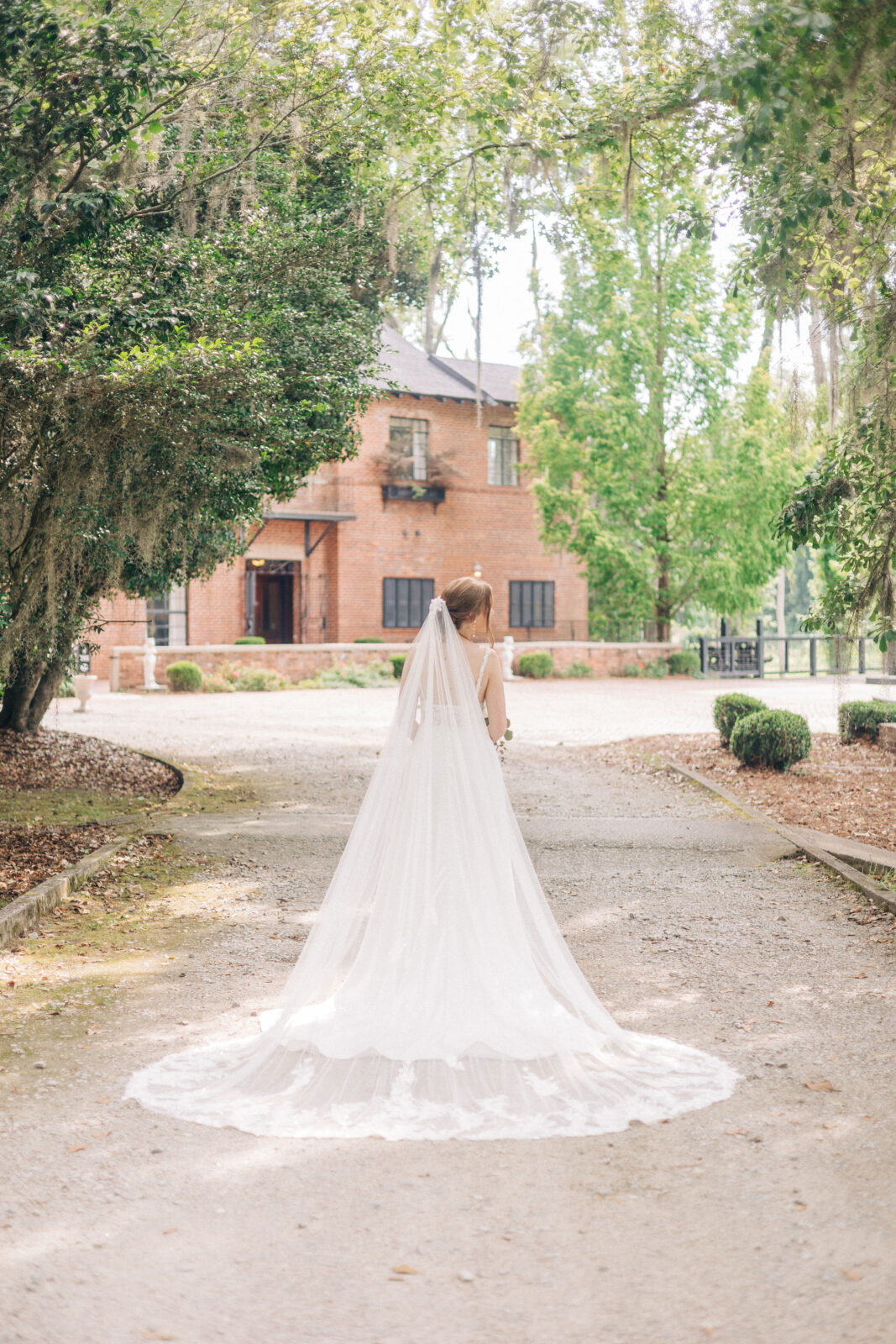 A bride walking toward a historic building