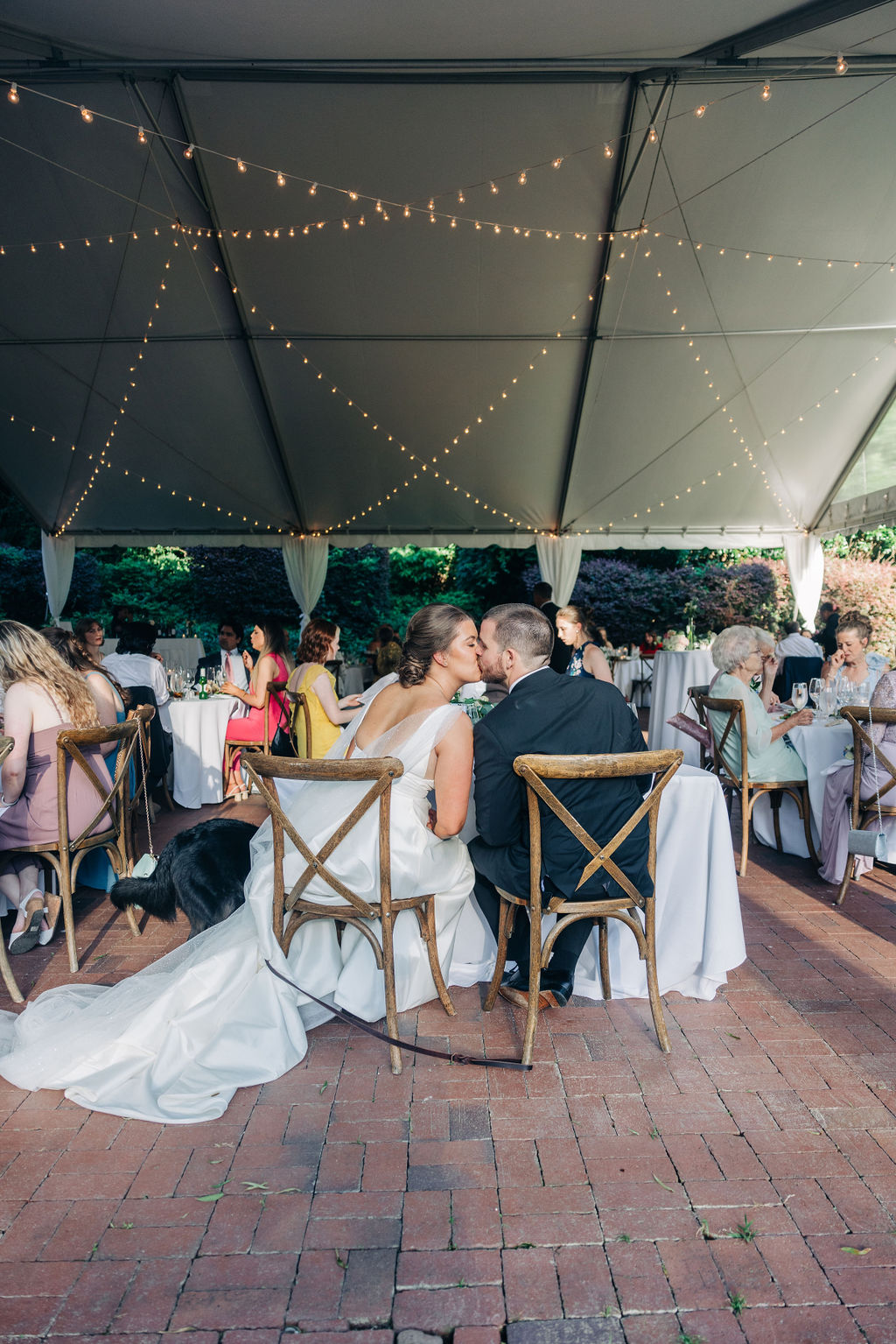 A newlywed couple sharing a quiet kiss