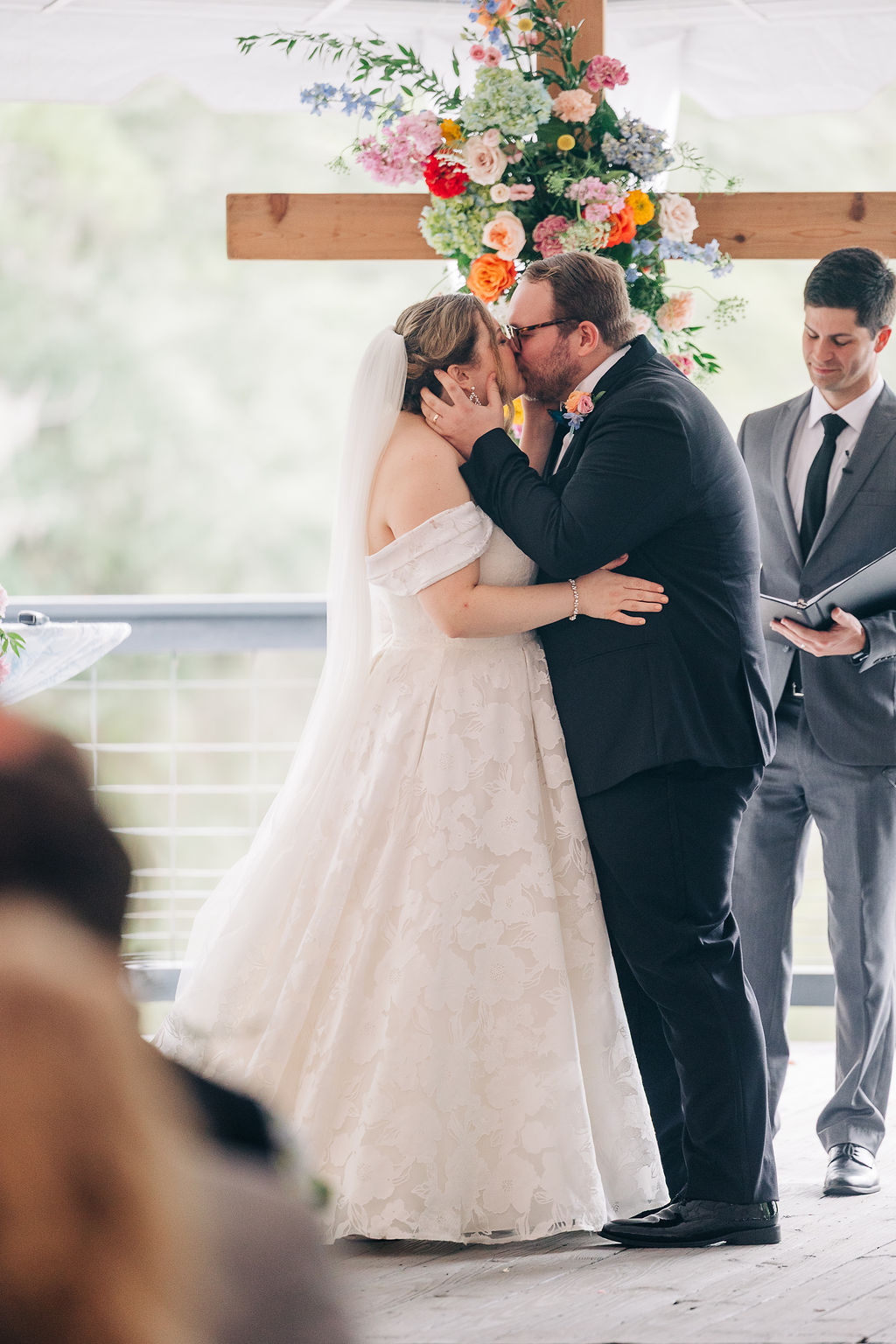 A couple's first kiss during the wedding ceremony