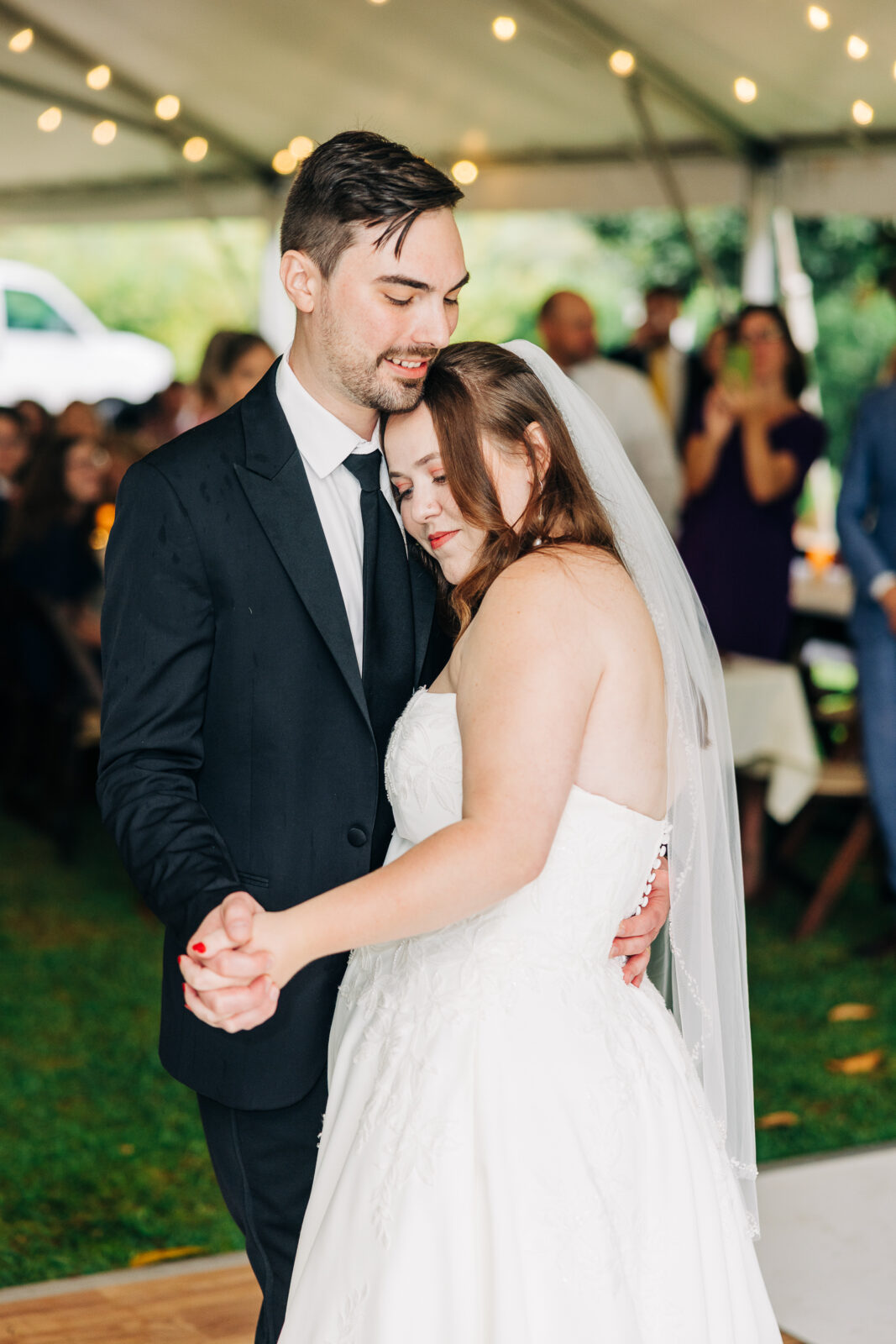 Romantic bride and groom first dance under a reception tent at Hampton-Preston Mansion wedding, Columbia, SC