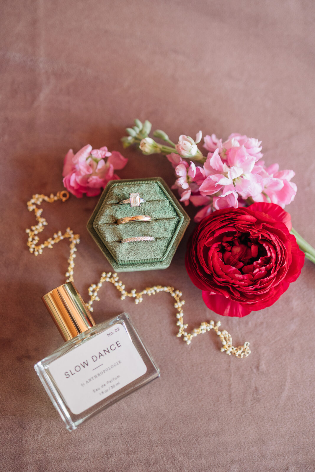 Wedding ring and detail flat lay photography at The Millstone at Adams Pond