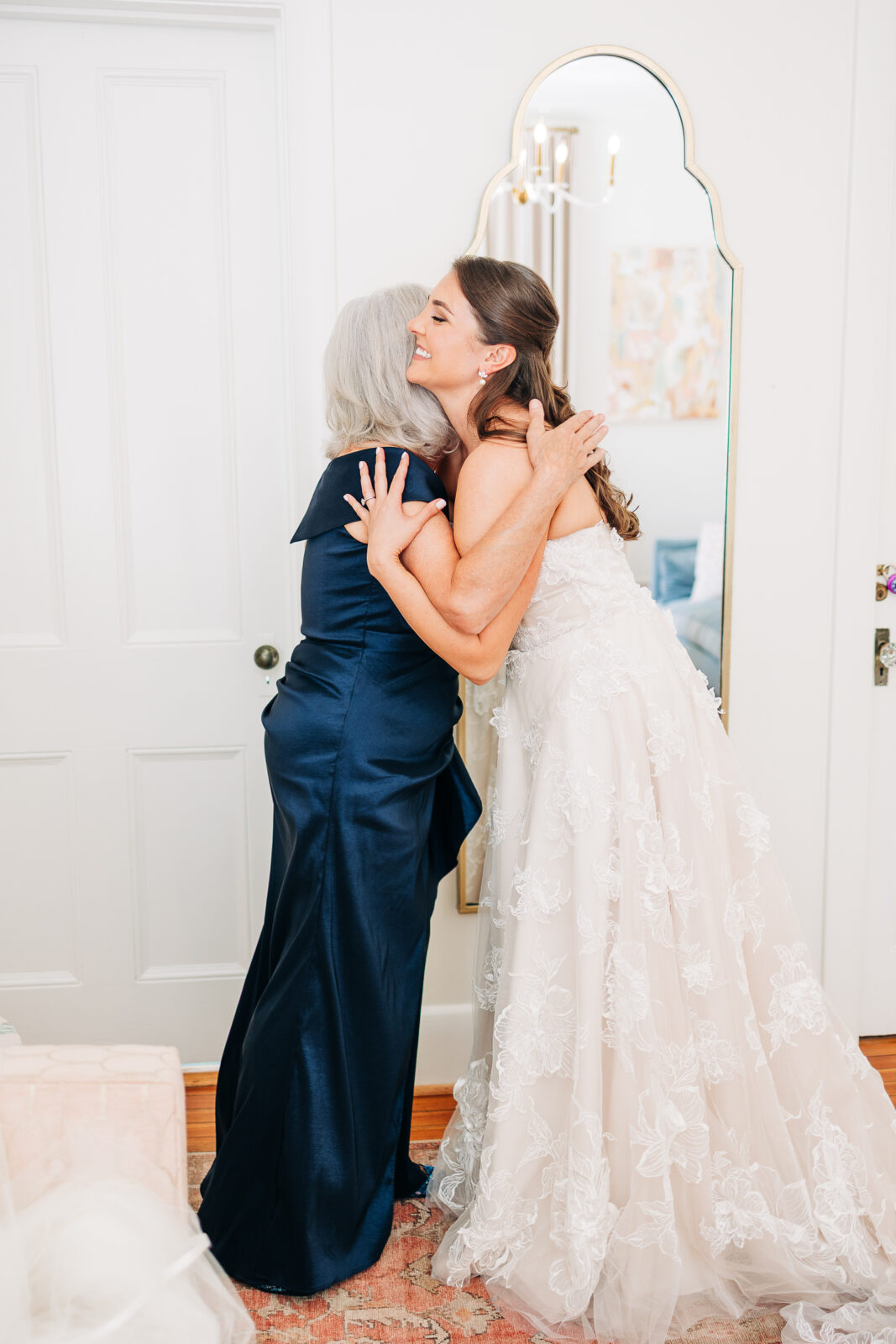 Sarah hugging her mother in the bridal suite at The Millstone at Adams Pond.