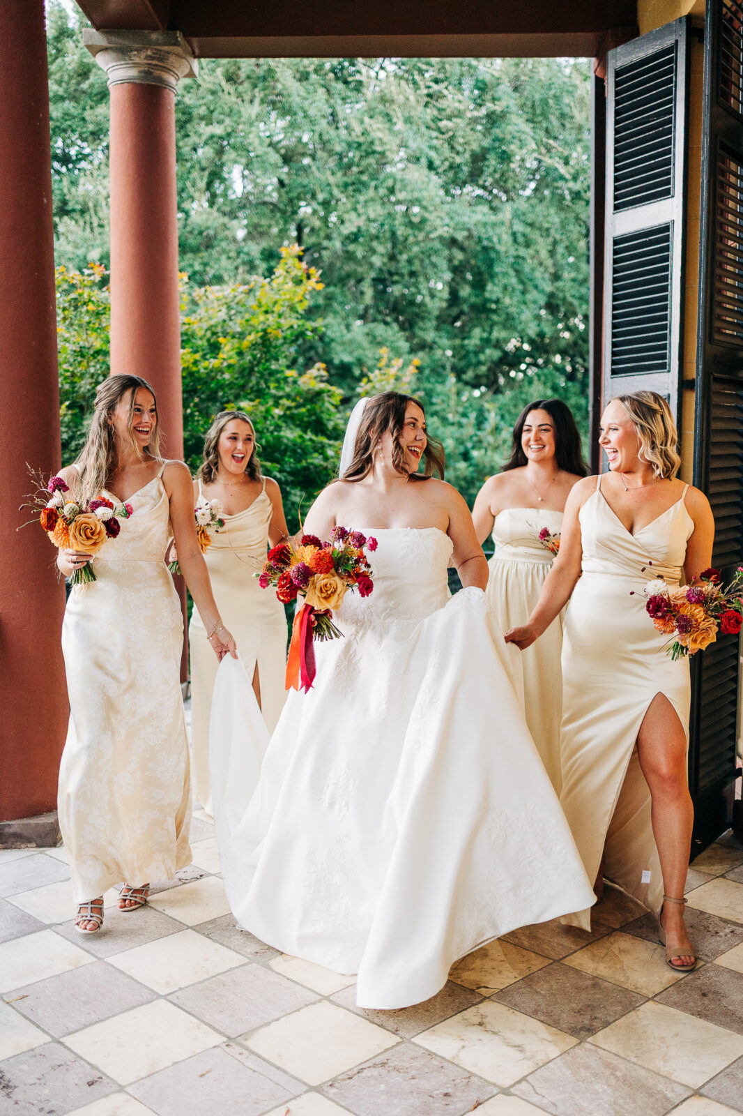 Emotional bride and groom first dance portrait under the white reception tent at Hampton-Preston Mansion, SC