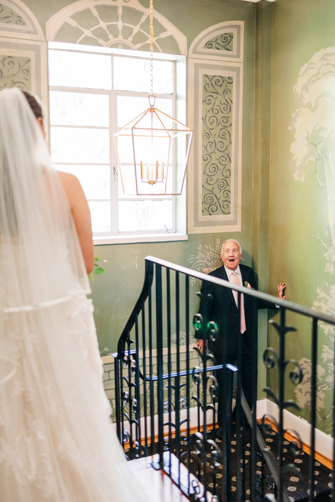 Emotional father of the bride reaction to seeing his daughter for the first time on the staircase at The Millstone at Adams Pond