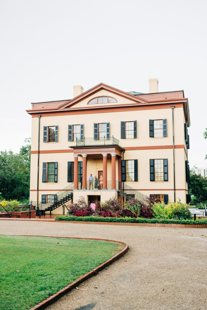 Exterior view of the historic yellow and red Hampton-Preston Mansion, a wedding and event venue in Columbia, South Carolina