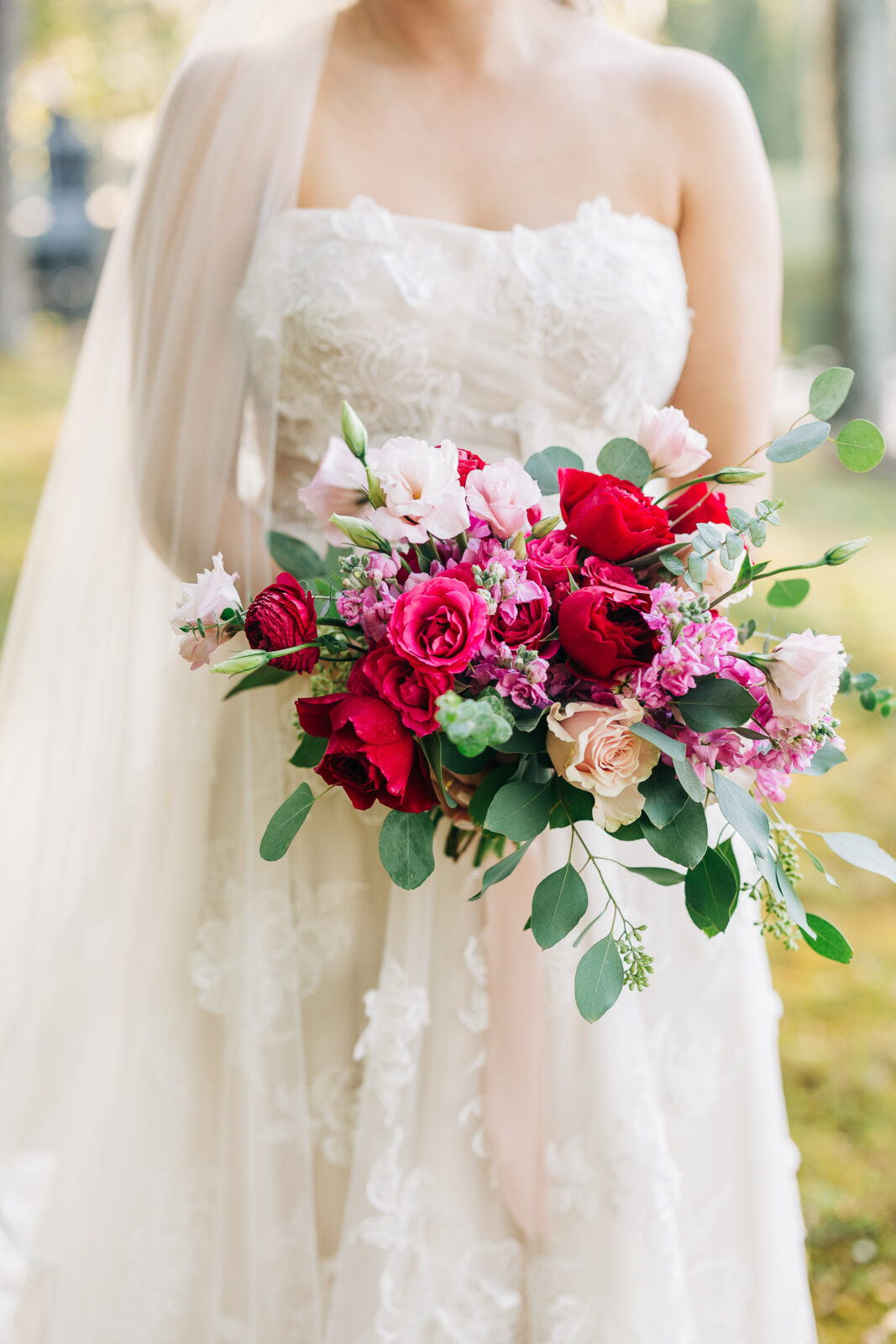 Bridal bouquet, red and pink roses, eucalyptus, wedding flowers, close-up
