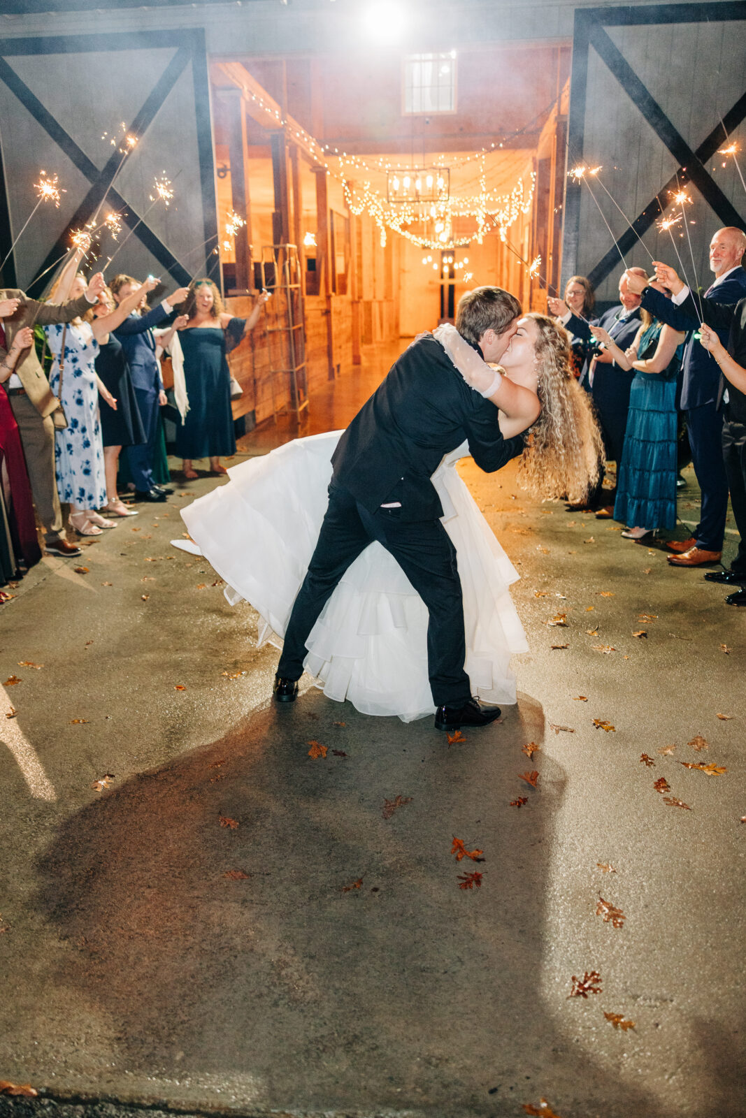 Romantic sparkler exit photo of the groom dipping the bride at Oakbrook Farms Wedding South Carolina