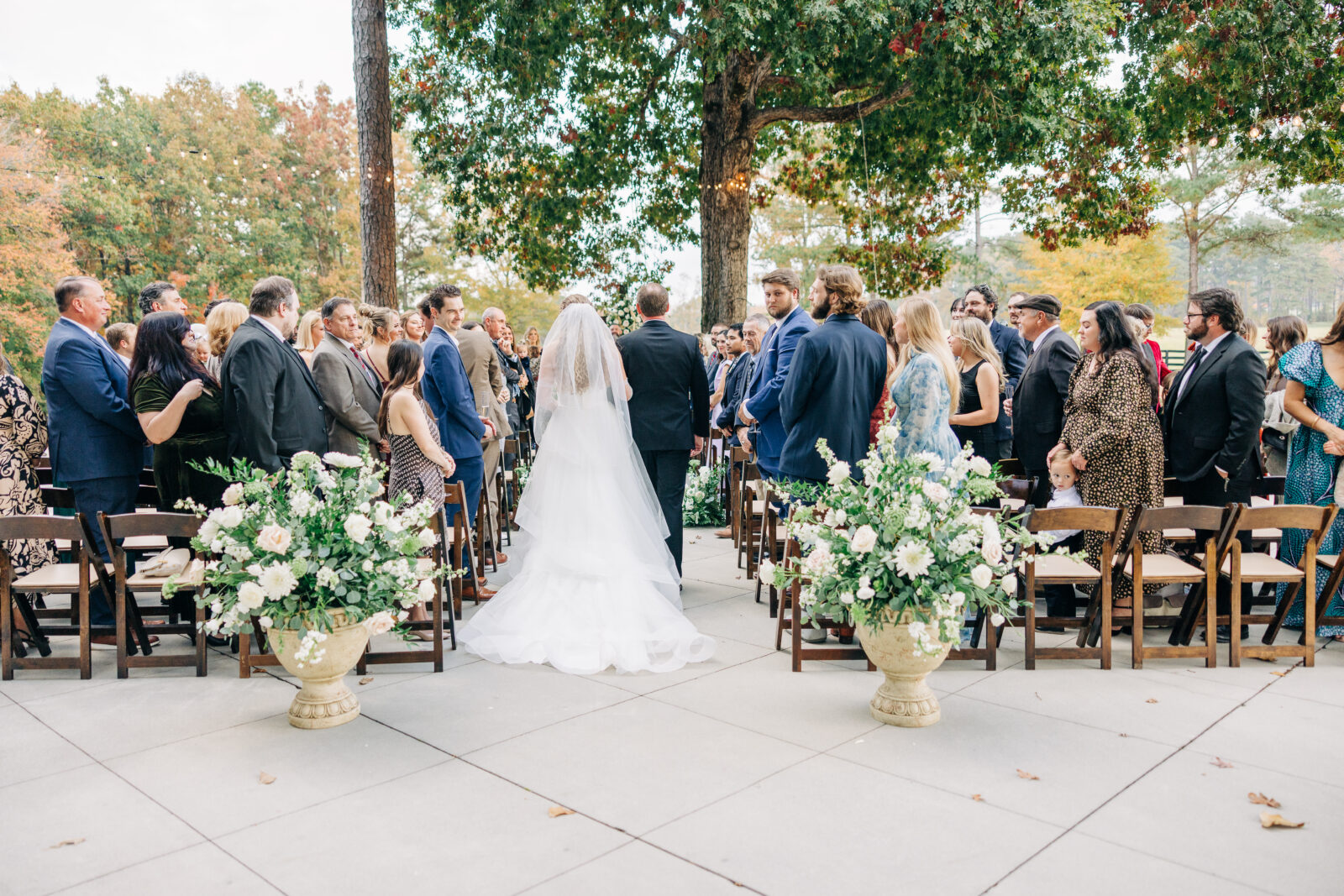 Bride and groom walking down the aisle after outdoor wedding ceremony at Oakbrook Farms