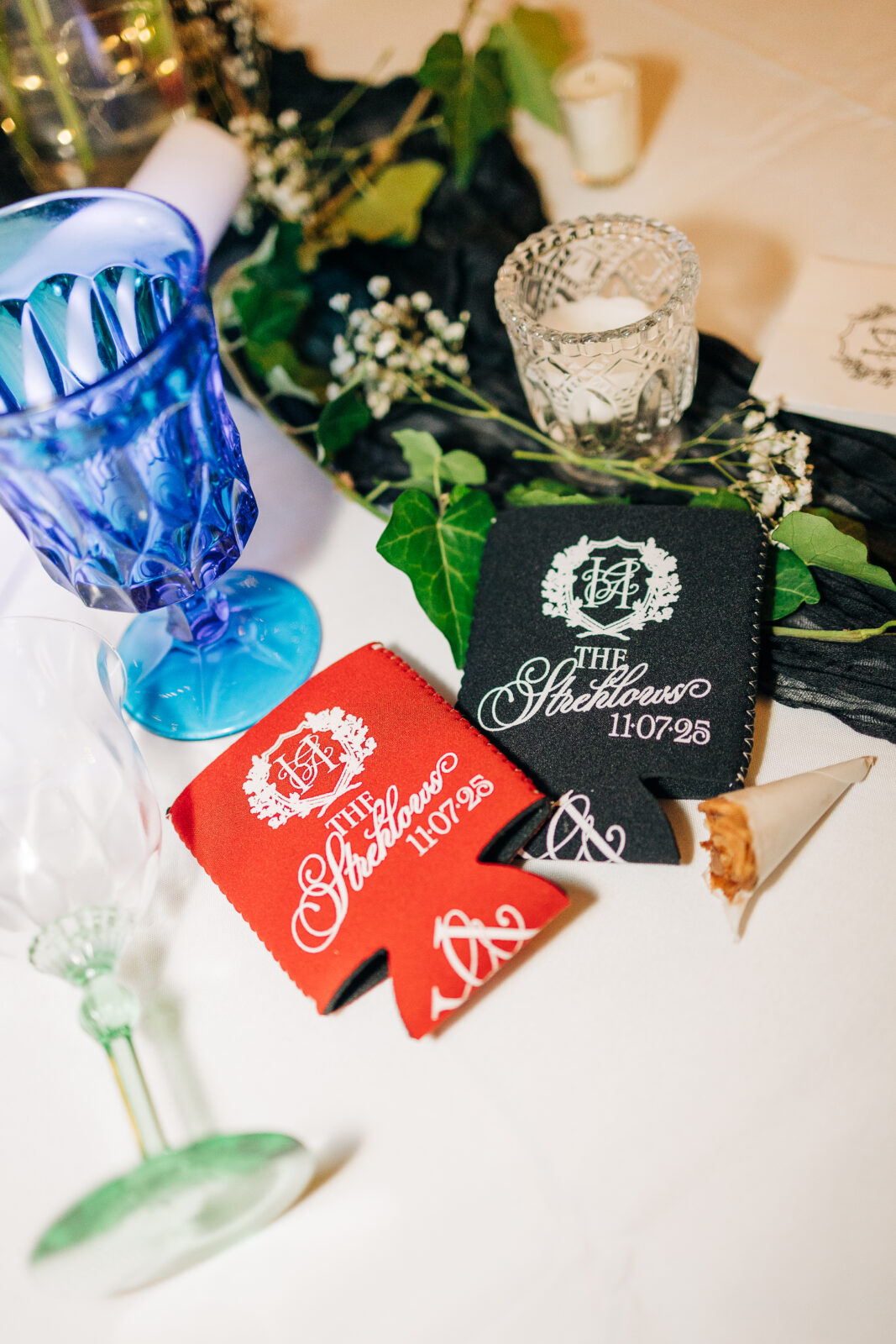 Candid shot of the bride, laughing and dancing in her tiered wedding gown, holding a glass and surrounded by guests on the dance floor under the tent at the Hartley House Wedding South Carolina reception
