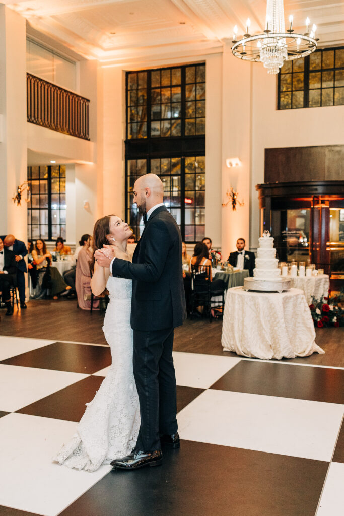 Bride and groom enjoying their first dance in the ballroom at 1208 Washington Place.