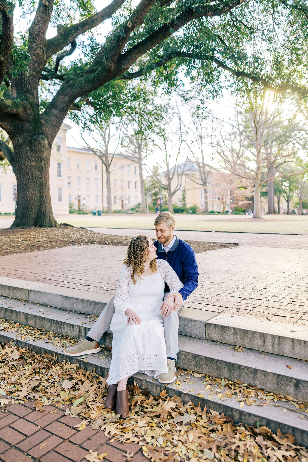 Engagement photos at a historic Columbia park with warm light and natural greenery