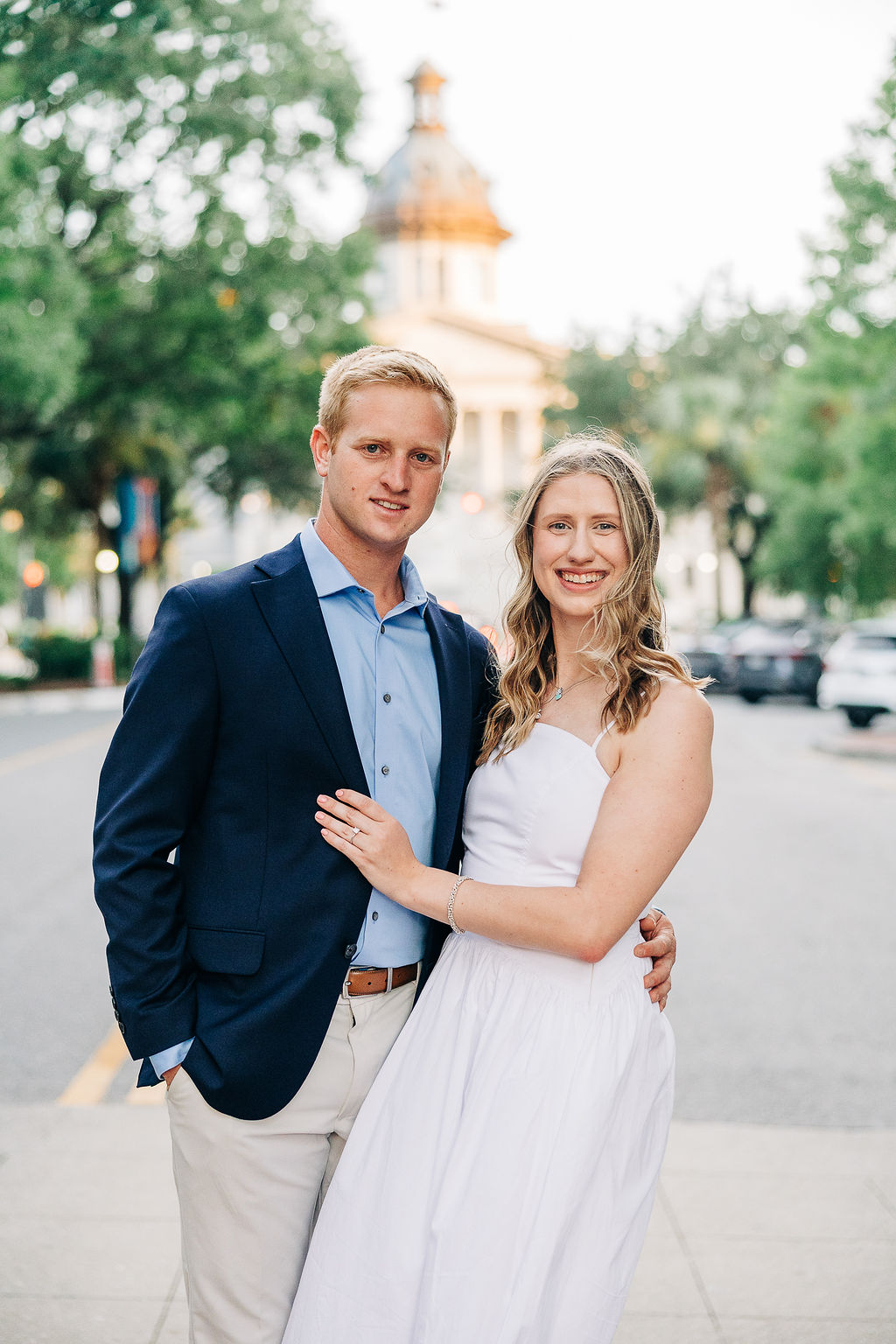 Couple posing in the street near the South Carolina State House during a downtown Columbia engagement session
