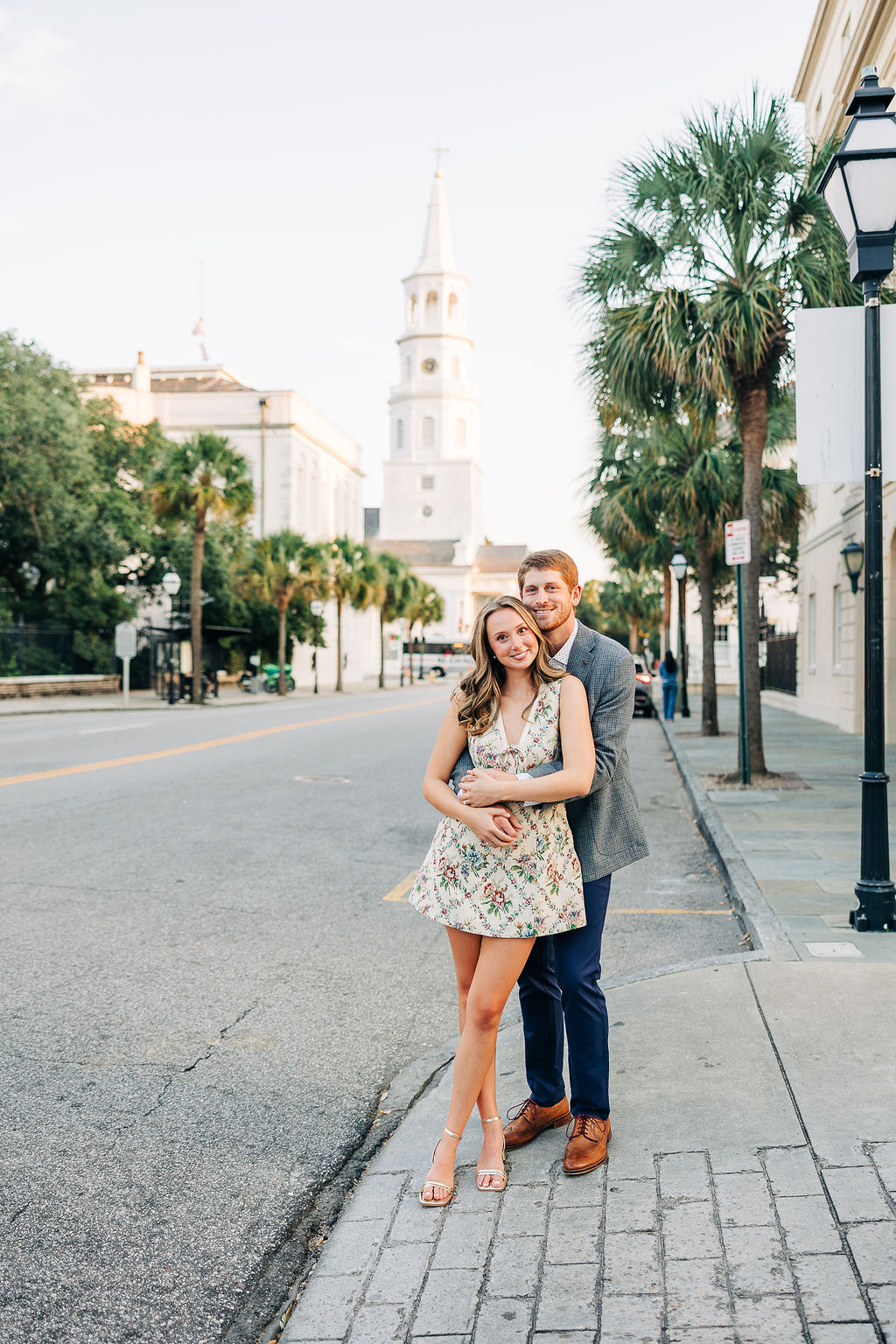 Engagement photos on historic stone steps featuring soft light and natural connection